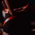 Spanking and Bondage: Why Is Submission Arousing? هارنس چرمی روی بدن در نور تاریک